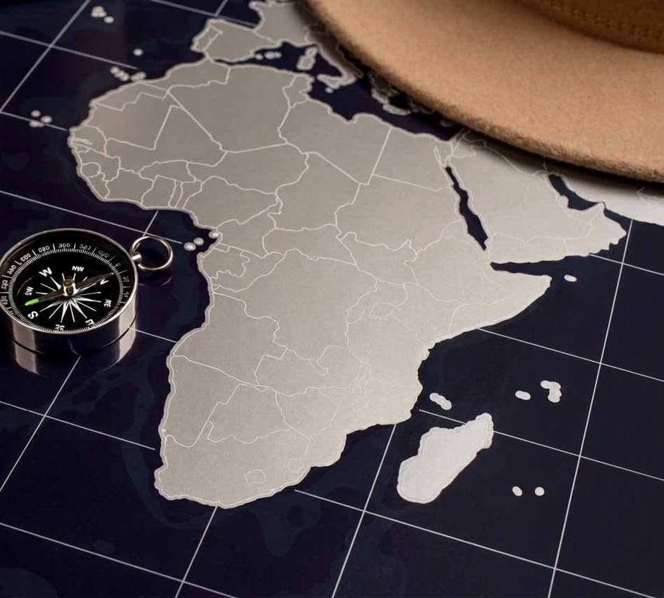 A metallic map of Africa with a compass, marking out each market