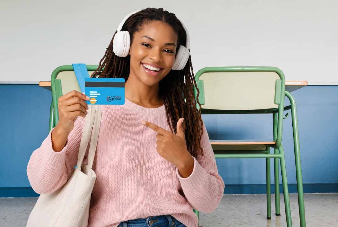 A student pointing at her Student Card KE